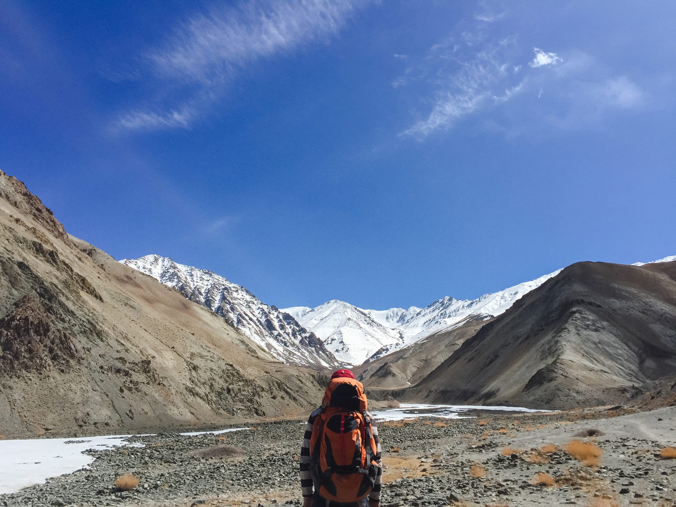 Man backpacker traveling hiking in mountains Travel Lifestyle success concept adventure active summer vacations outdoor mountaineering sport - Vintage effect style pictures.
